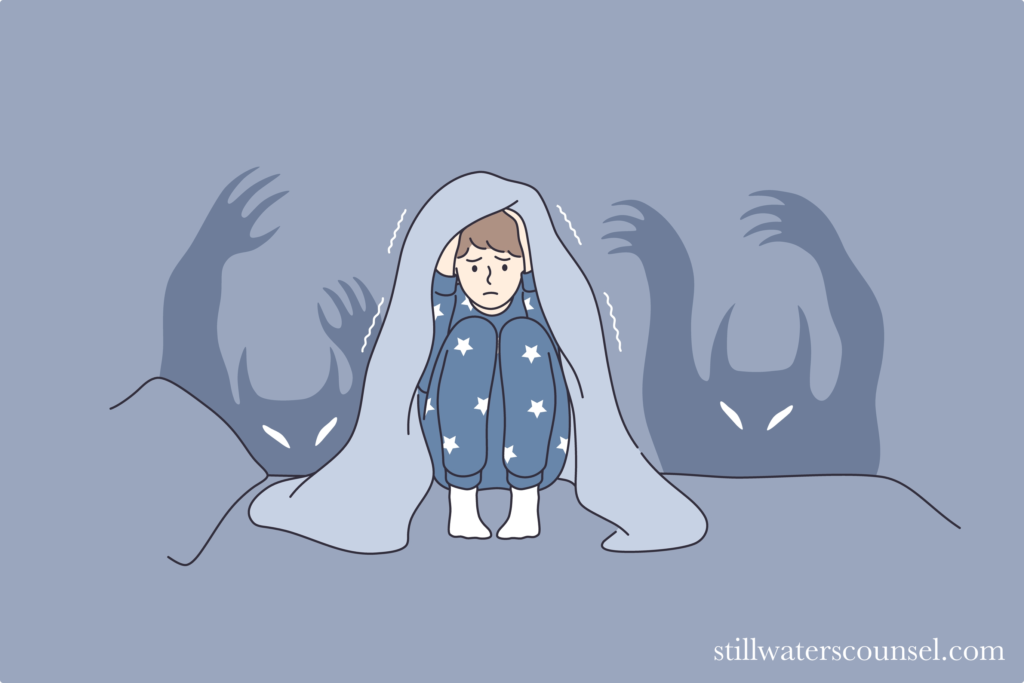Cartoon drawing in blue hues of scared Caucasian person hiding from monsters shaking