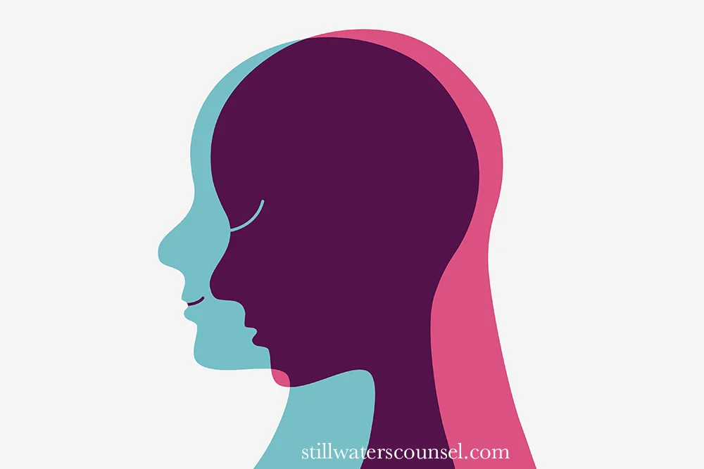 Silhouettes of two faces overlap, one in teal and the other in pink, set against a light gray background. The image suggests themes of duality or connection.