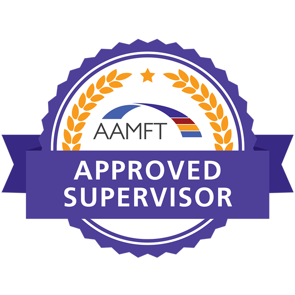 A purple and gold badge featuring the text AAMFT Approved Supervisor with a star, laurel wreath, and a curved strip with red, blue, and orange lines above the word AAMFT.